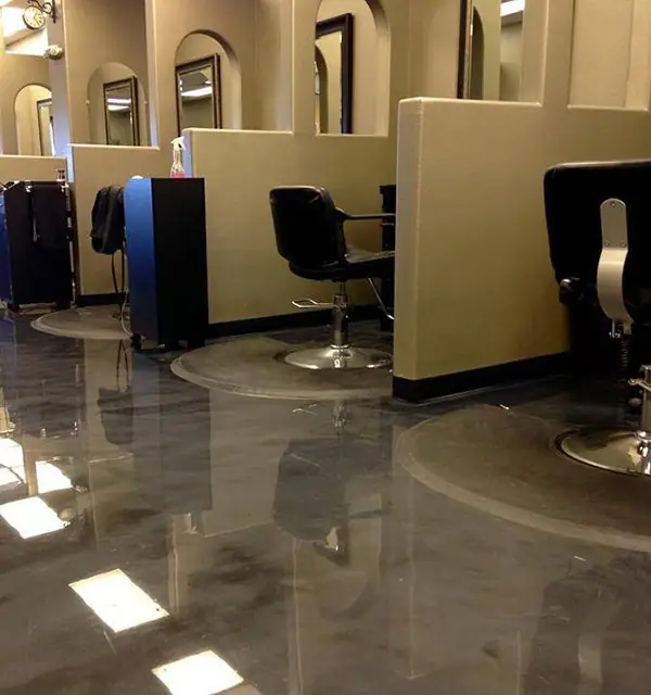 Salon with styling chairs on a glossy metallic epoxy floor