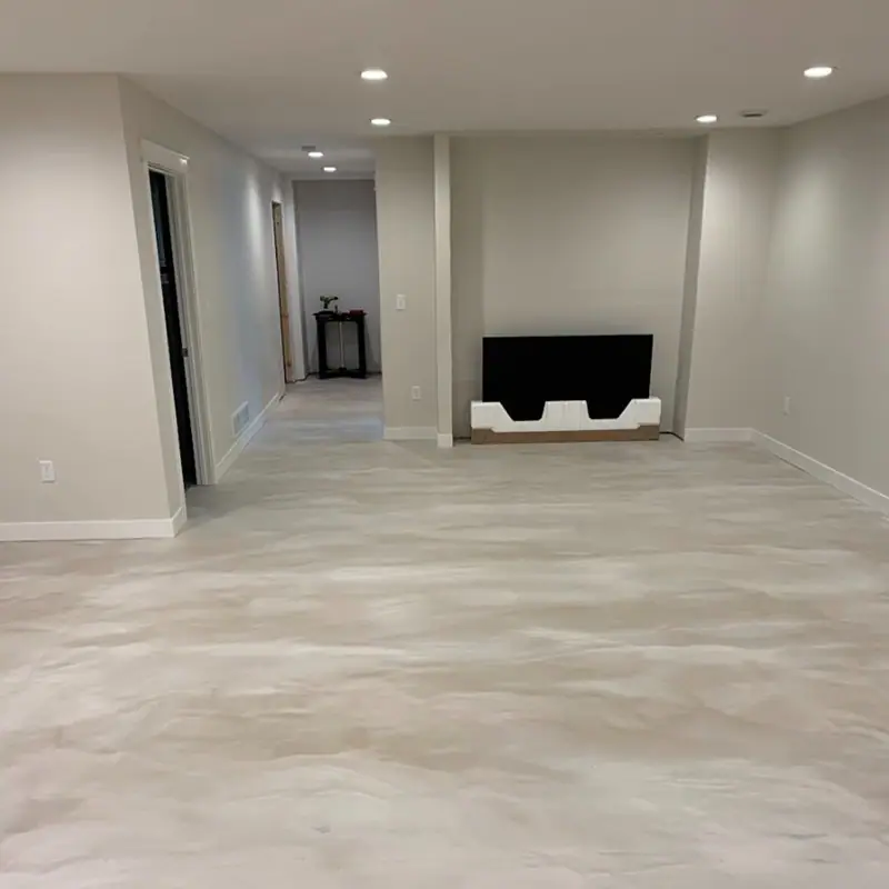 Bright commercial corridor with a light gray seamless floor