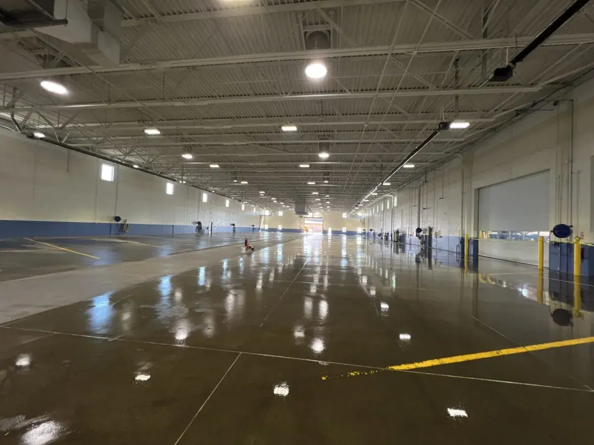 Large industrial facility floor with yellow safety lines