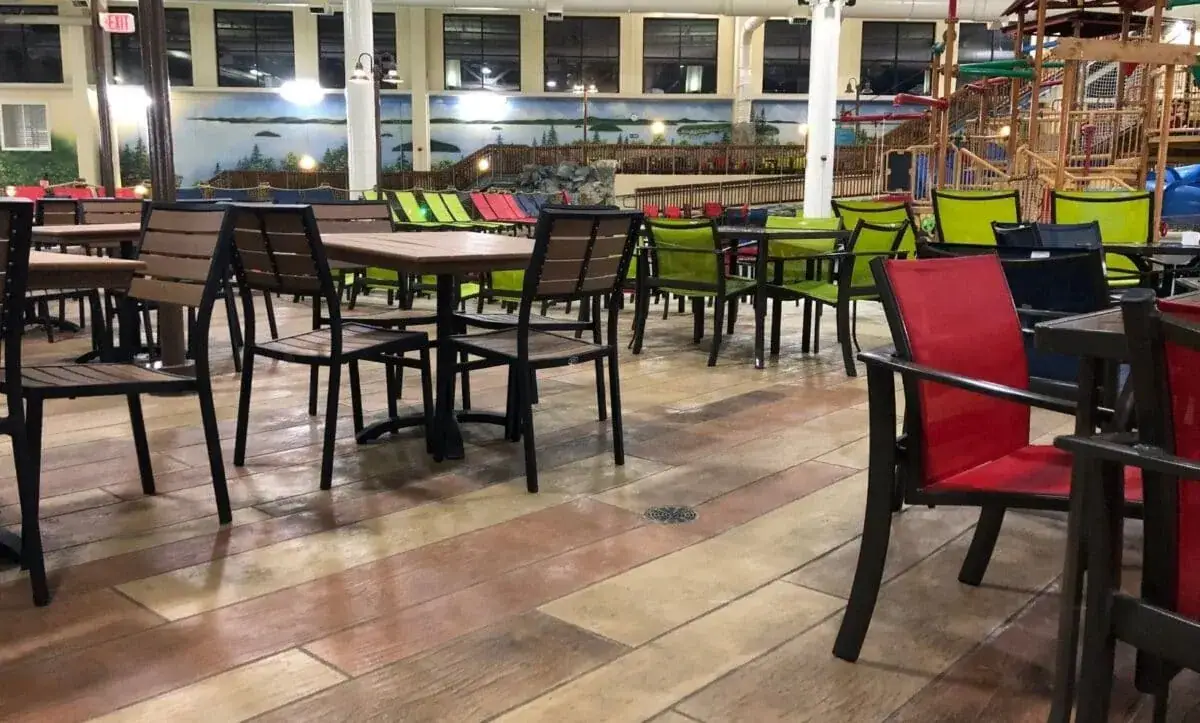 Restaurant seating area with a decorative coated concrete floor