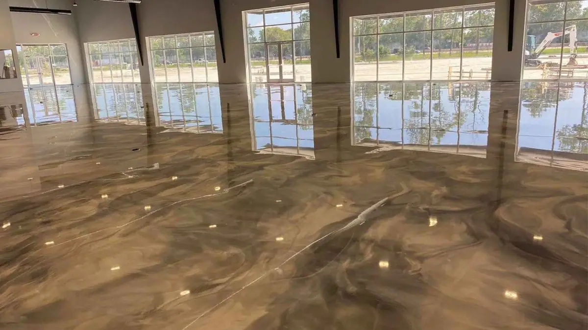 Large commercial space with a glossy metallic epoxy floor