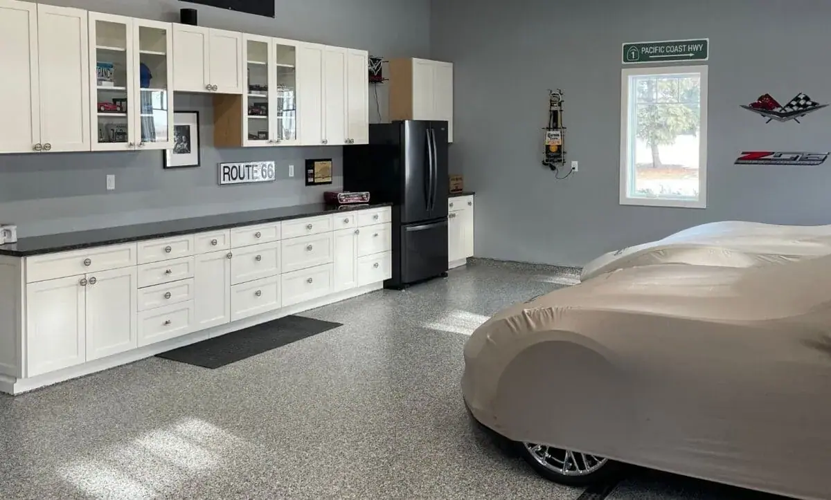 Flake epoxy garage floor with a parked car